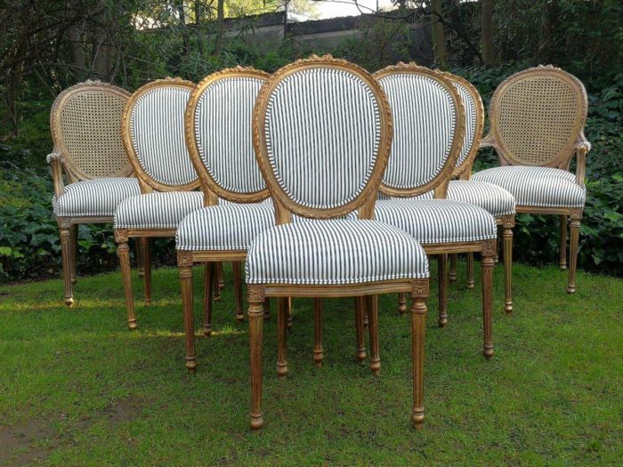 A 20th Century French Style Imported Set Of Twelve Gilded Dining Chairs Comprising: Two Carvers  /  Armchairs With Rattan Backs And Ten Dining Chairs - Image 2