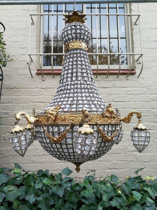 A French Empire Style Brass and Gilt Chandelier