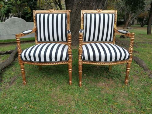 A Pair Of Louis XVI Carved And Gilded Armchairs