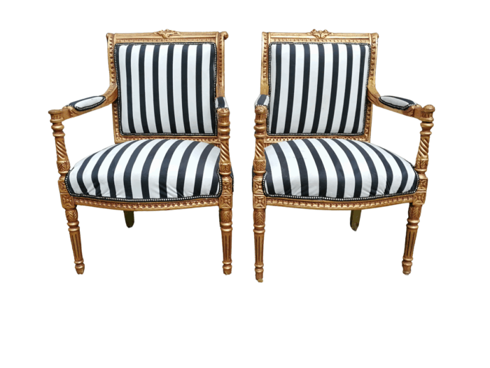 A Pair Of Louis XVI Style Carved And Gilded Armchairs