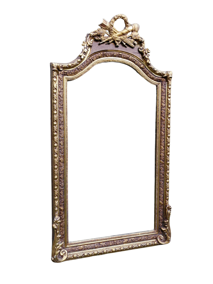 A French Rococo Style Ornately Carved and Gilded Bevelled Mirror