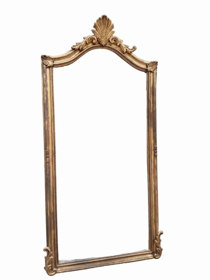 A French Style Ornately Carved And Gilded Bevelled Mirror