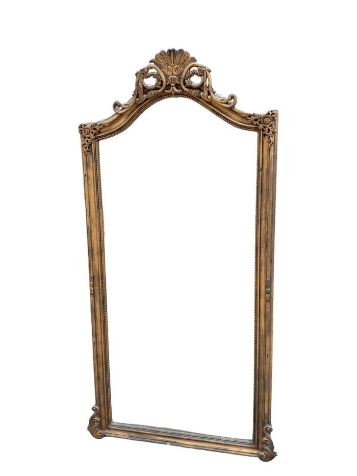 A French Style Rococo Ornately Carved And Gilded Bevelled Mirror