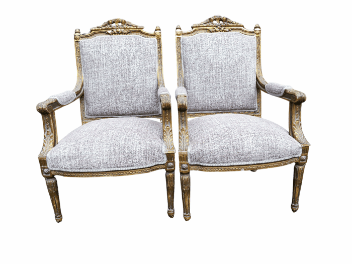 A Pair Of French Style Giltwood Ornate Arm Chairs On Fluted Legs