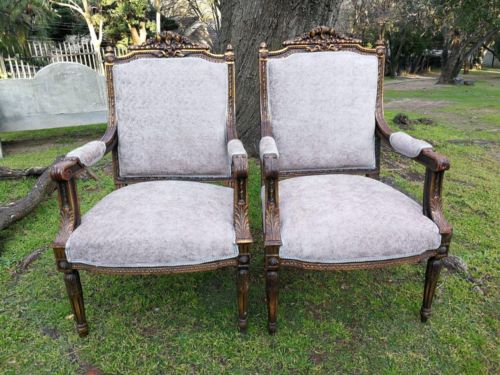 A Pair of French Style Giltwood Ornate Arm Chairs on Fluted legs 