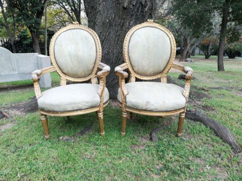 A Pair Of French Style Giltwood Ornate Arm Chairs On Fluted Legs 