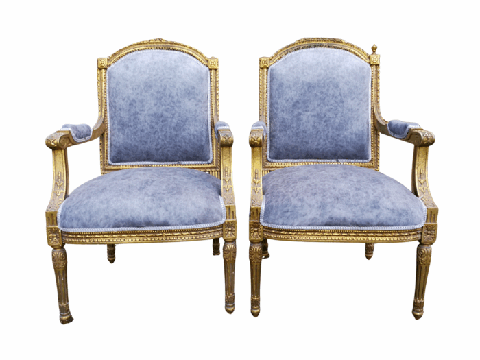 A Pair of French Style Giltwood Ornate Arm Chairs on Fluted legs 