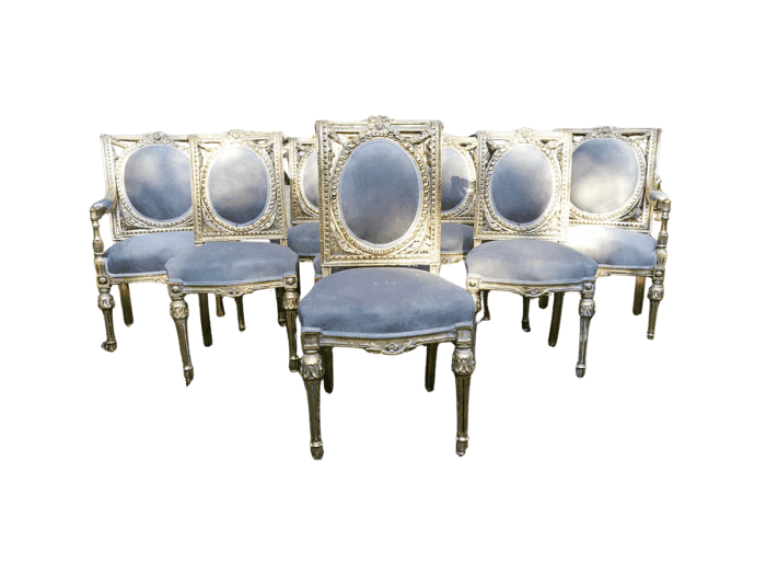 A Set of Eight French Style Ornately Carved and Gilded Dining Chairs (6 chairs and 2 Carvers)