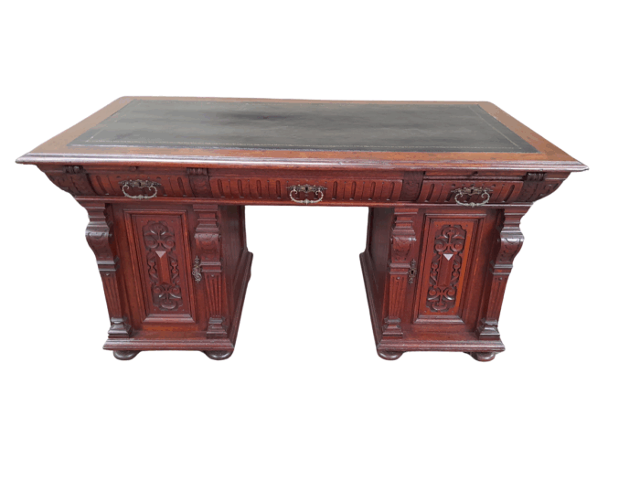 An Antique 19th Century Oak Carved and Ebonised Desk with Three Drawers and Two Pedestals with Tooled Leather Top Desk with Drawers
