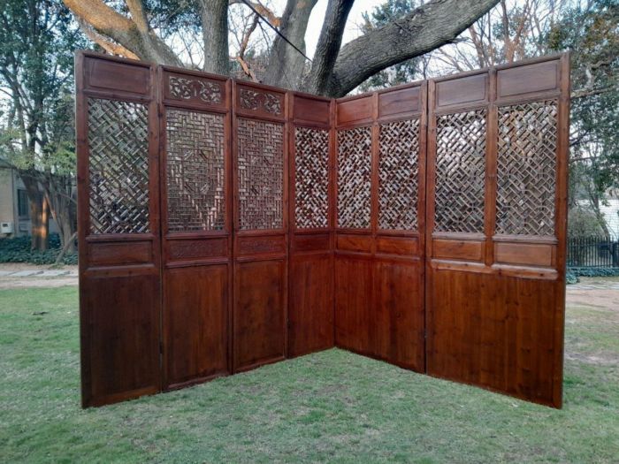A First Half 20th Century Set Of Seven Chinese Elmwood Screen Panels. Consisting Of Five Single Panels And Two Double Panels