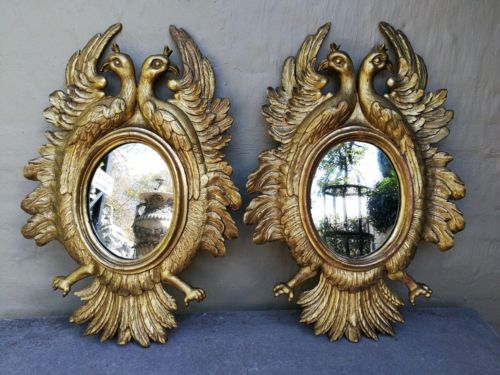 A 20th Century Pair Of Carved Mirrors With Stylised Bird Design