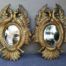 A 20th Century Pair Of Carved Mirrors With Stylised Bird Design