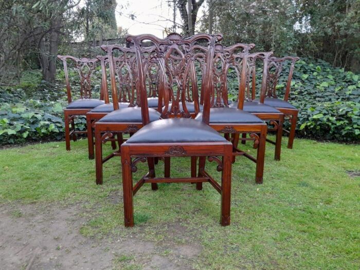 A 20TH Century English Set of Ten Carved Mahogany Chippendale Style Chairs