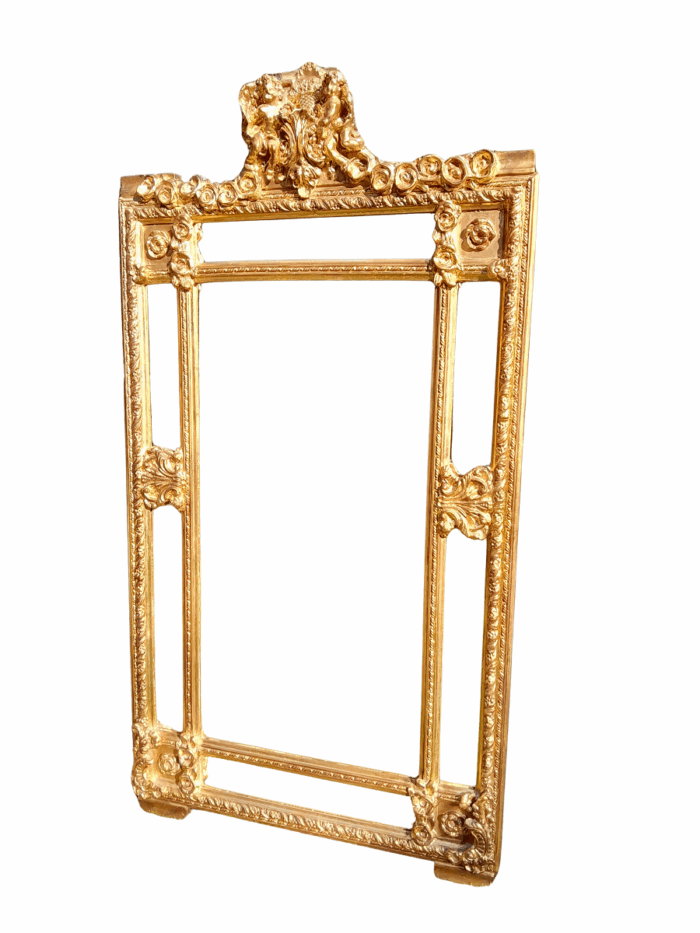 A French Style Ornately Carved and Gilded Bevelled Mirror