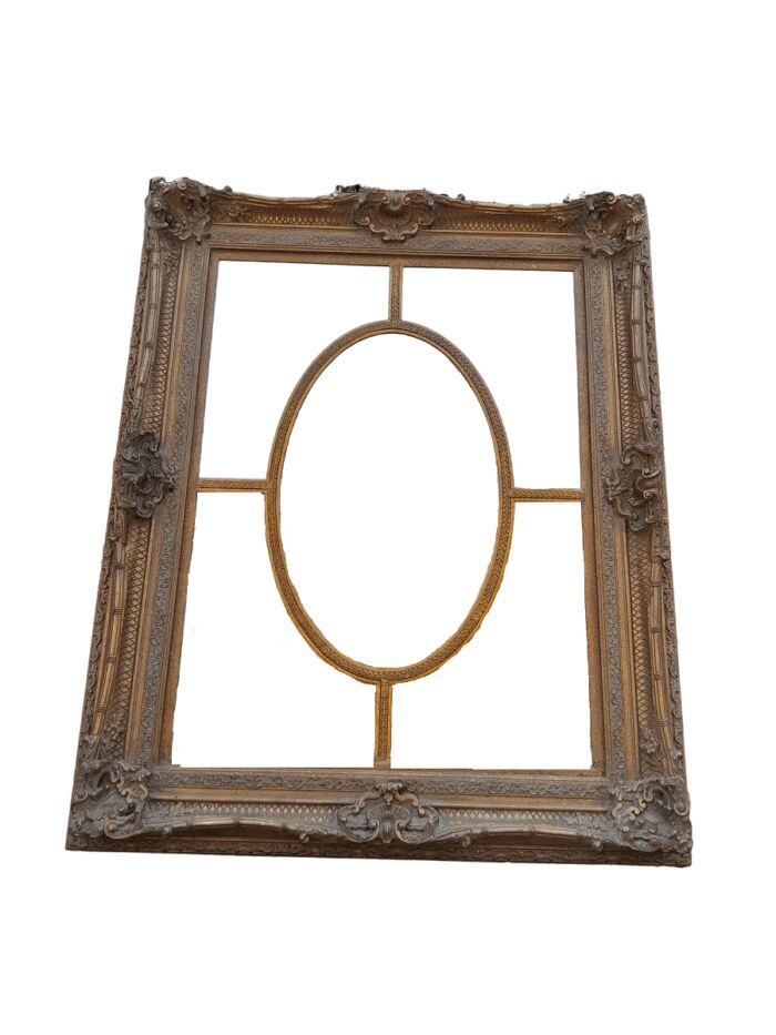 A Large and Heavily Carved Giltwood Bevelled Mirror