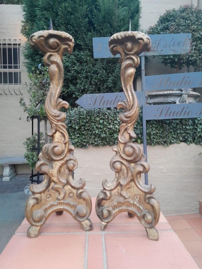 A 19th Century Pair of French Rococo Gilt-wood Carved Candlesticks