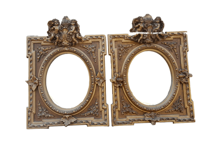 An Exceptional Pair of 20th Century French Style Ornately Carved and Gilded Bevelled Mirrors with Cherubs