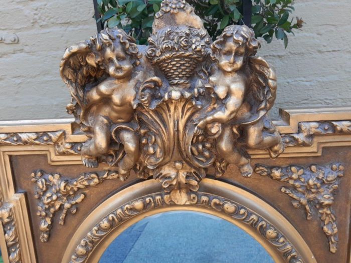 An Exceptional Pair of 20th Century French Style Ornately Carved and Gilded Bevelled Mirrors with Cherubs - Image 4