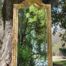 A French Rococo Style Ornately Carved and Gilded Bevelled Mirror