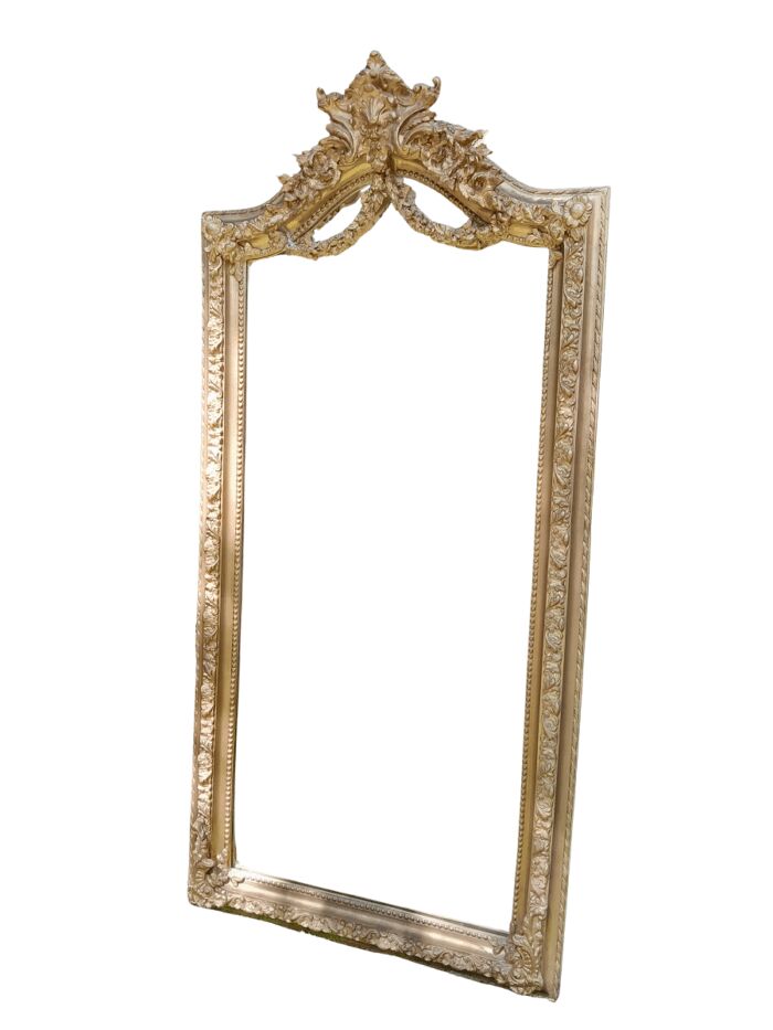 A French Rococo Style Ornately Carved and Gilded Bevelled Mirror