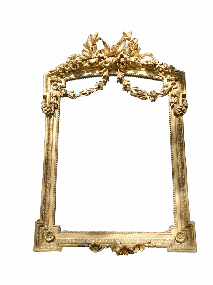 A French Rococo Style Ornately Carved and Gilded Bevelled Mirror