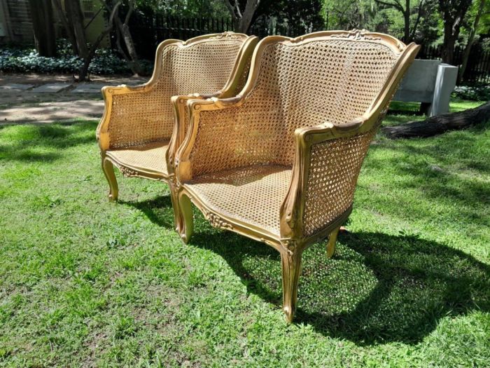 A 20th Century Pair of French Style Rattan Hand Gilded Wing Back Chairs - Image 3