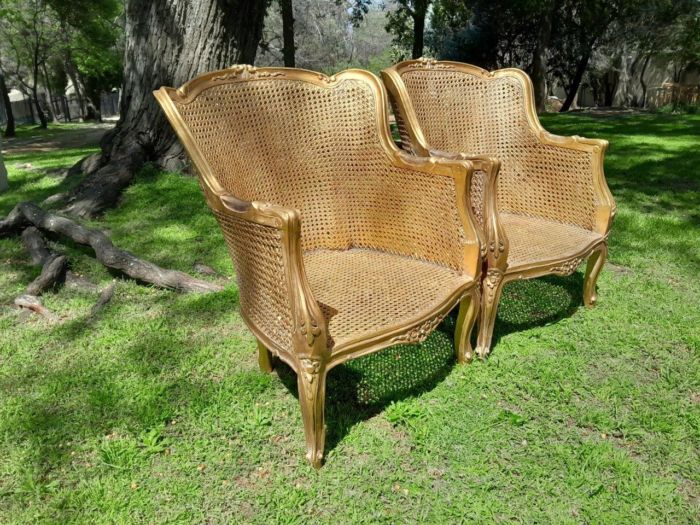 A 20th Century Pair of French Style Rattan Hand Gilded Wing Back Chairs - Image 4
