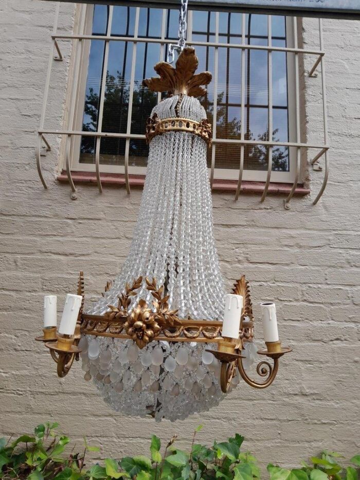 A 20th Century French Style Brass & Aged Chandelier