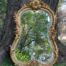 A French Rococo Style Ornately Carved and Gilded Bevelled Mirror