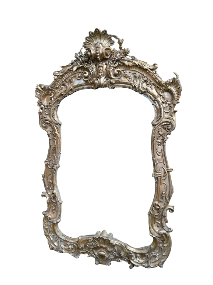 A French Rococo Style Ornately Carved and Gilded Bevelled Mirror