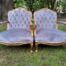 A French Style Pair Of Ornately Carved Gilt Wood Armchairs