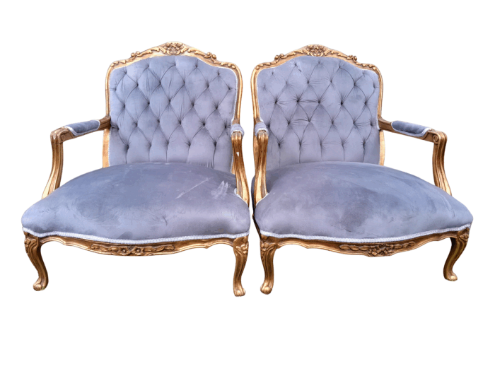 A French Style Pair Of Ornately Carved Gilt Wood Armchairs