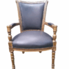 A 20th Century French Louis XVI Styled Ornately Carved And Gilded Arm Chair upholstered in black leather