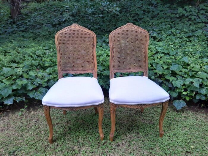 A Rare 20th Century Set Of Twelve French Colonial Style Walnut Rattan Dining Chairs - Image 6