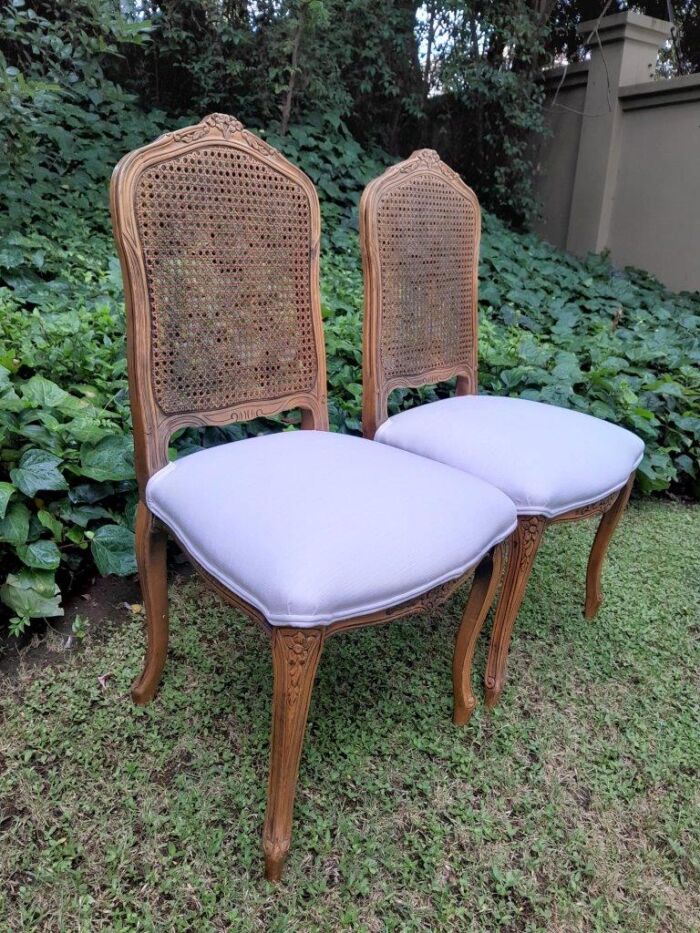 A Rare 20th Century Set Of Twelve French Colonial Style Walnut Rattan Dining Chairs - Image 7