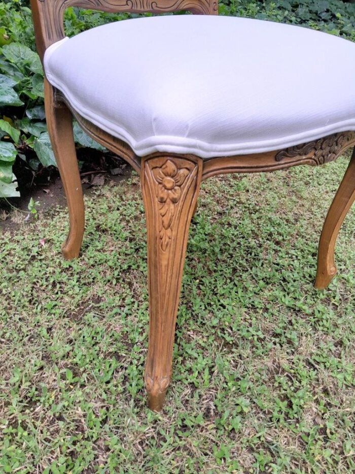 A Rare 20th Century Set Of Twelve French Colonial Style Walnut Rattan Dining Chairs - Image 9