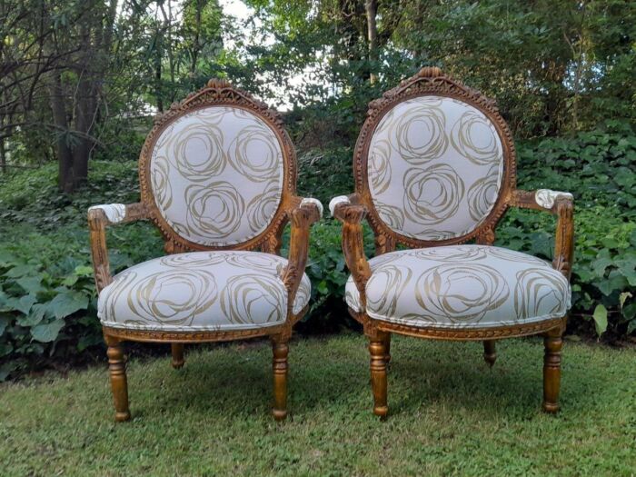 A Late 19th/Early 20th Century French Pair Of Gilded Carved Bergere Chairs