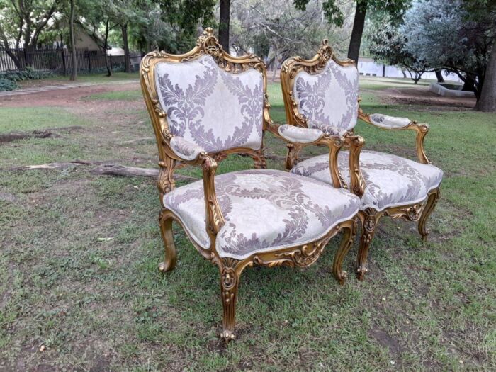 A 20th Century Pair Of French Rococo Style Ornately Carved Wooden Gilt-Wood Arm Chairs - Image 3