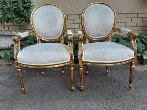 A French Style Pair Of Wooden Armchairs