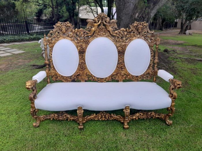 A 19th Century Ornately Carved Walnut Wood Settee Hand Gilded With Gold Leaf And Upholstered In A Linen Fabric - Image 2