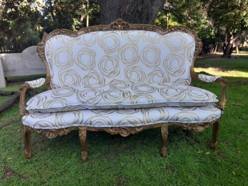 A 20TH Century French Hand Carved and Hand Gilded Settee