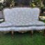 A 20TH Century French Hand Carved and Hand Gilded Settee