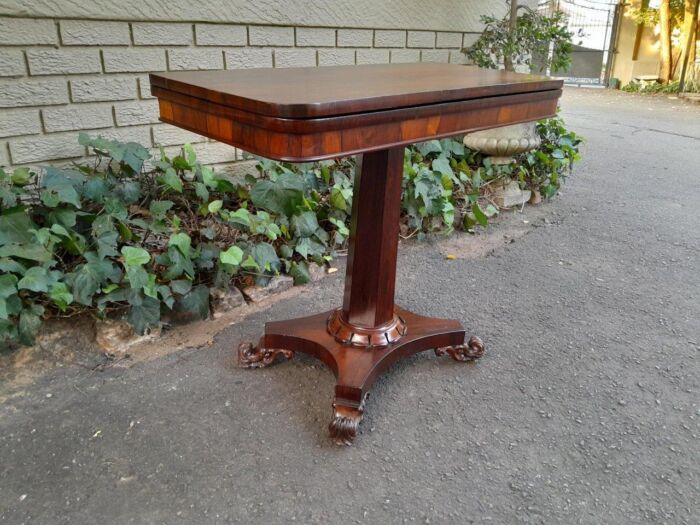 A Victorian rosewood swivel and tilt Card Table, on spreading hexagonal column to the concave platform base on knurl feet with castors - Image 3