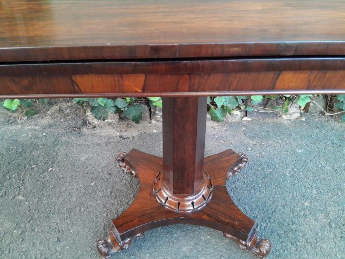A Victorian rosewood swivel and tilt Card Table, on spreading hexagonal column to the concave platform base on knurl feet with castors - Image 6