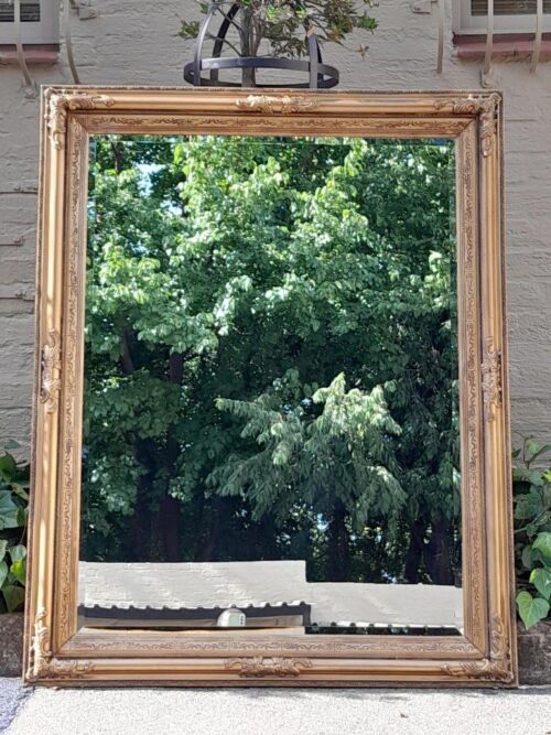 A Carved Gilt Wood Bevelled Mirror