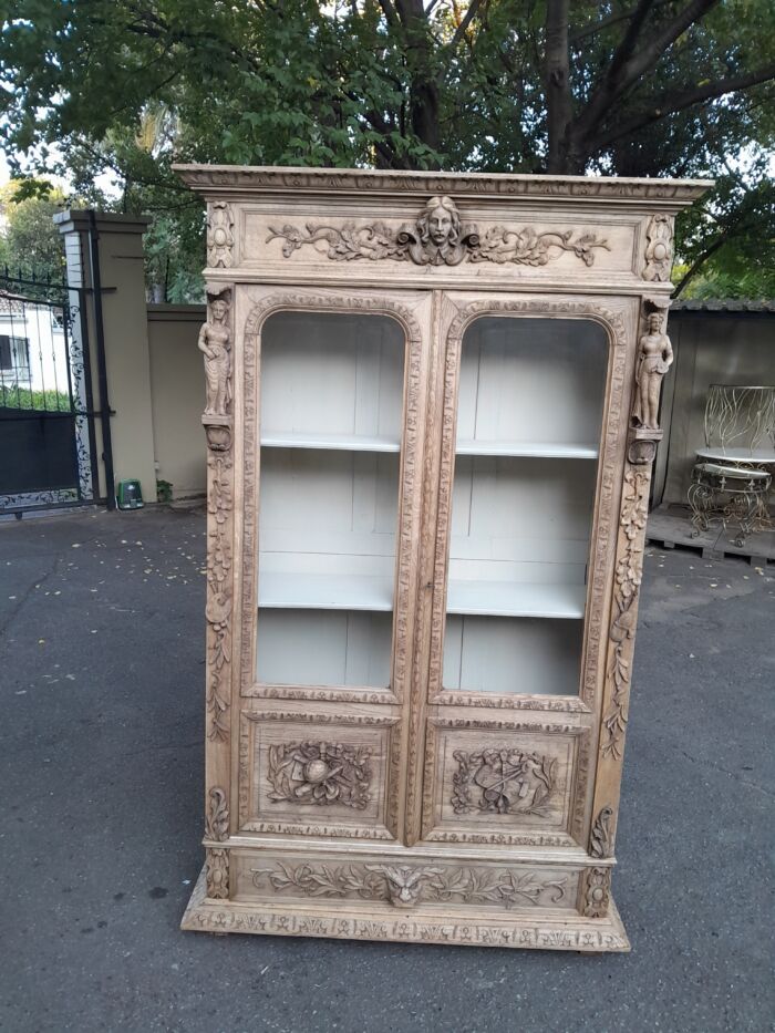 An Antique 19th Century Circa 1880 Large Renaissance-Revival European Oak Carved Bookcase / Cabinet With Glazed Glass Doors in a Contemporary Natural / Bleached Finish - Image 4