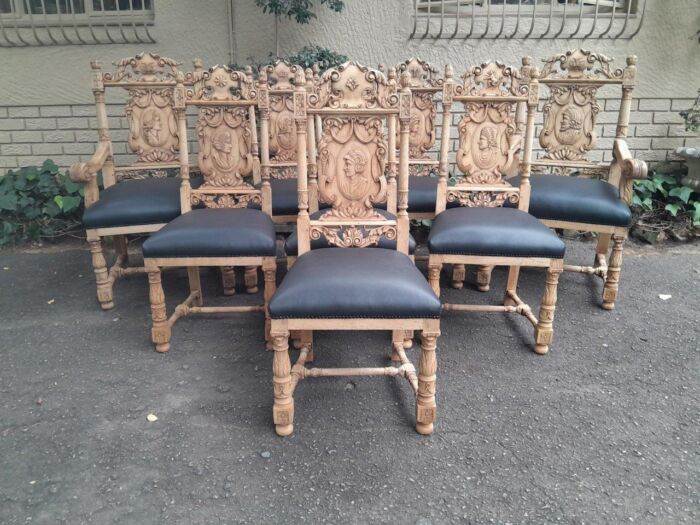 A 19th Century Circa 1880  Renaissance Revival Ornately Carved Oak Set of Dining Chairs Comprising a Pair of Carvers / Armchairs and Six Dining Chairs Upholstered in Leather and in a Contemporary Bleached Finish