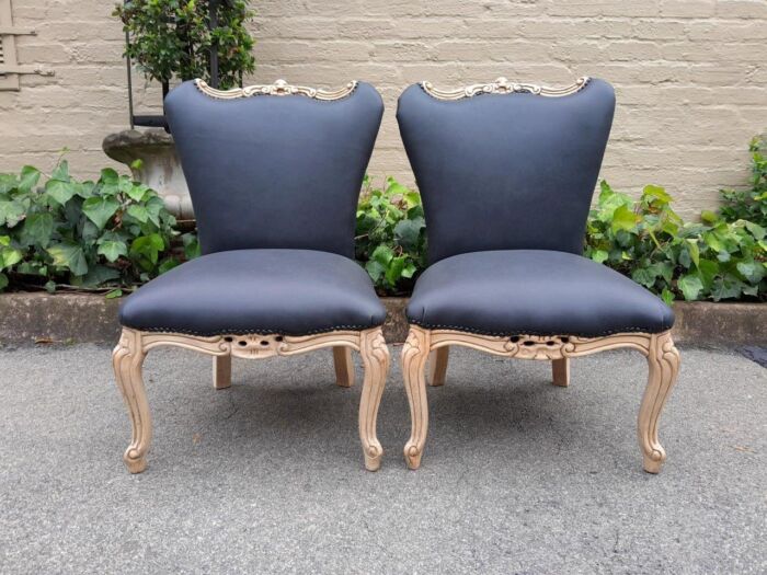 A 20TH Century Pair of Mahogany Slipper Chairs Finished in a Contemporary Bleached Finish and Upholstered in Leather