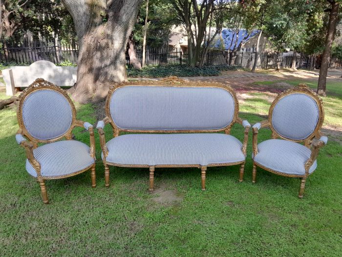A 20th Century French Style Ornately Carved and Gilded Set Of Settee And a Pair Of Armchairs Upholstered in an Imported Fabric - Image 2