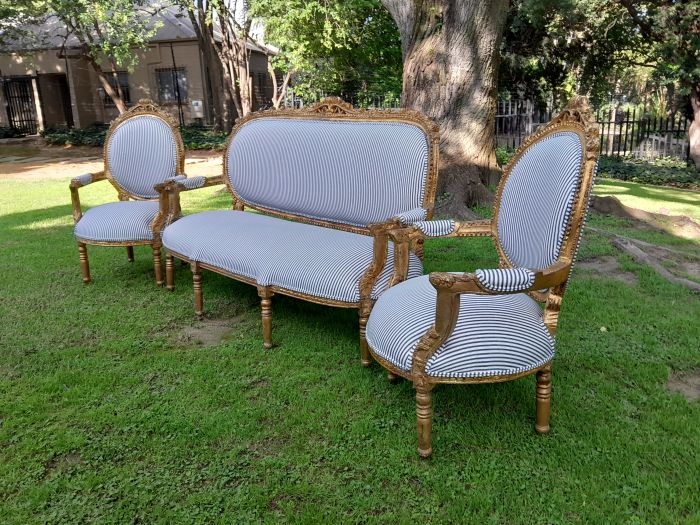 A 20th Century French Style Ornately Carved and Gilded Set Of Settee And a Pair Of Armchairs Upholstered in an Imported Fabric - Image 3